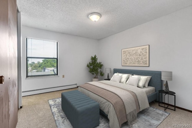 512 E Monroe Dr Unit D438, Fort Collins, CO 80525 - bedroom with baseboard heating, carpet, and a textured ceiling
