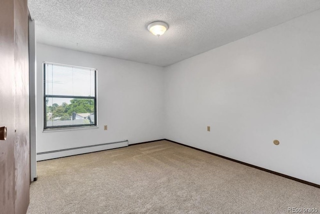 512 E Monroe Dr Unit D438, Fort Collins, CO 80525 - unfurnished room featuring a baseboard radiator, carpet flooring, and a textured ceiling