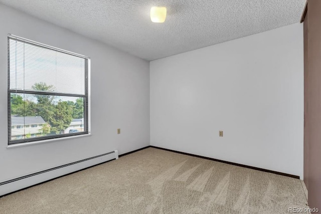 512 E Monroe Dr Unit D438, Fort Collins, CO 80525 - carpeted spare room featuring a baseboard heating unit and a textured ceiling