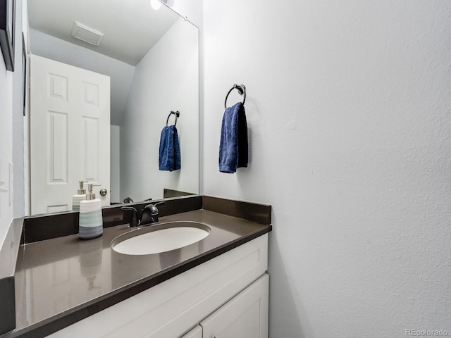 bathroom featuring vanity and visible vents