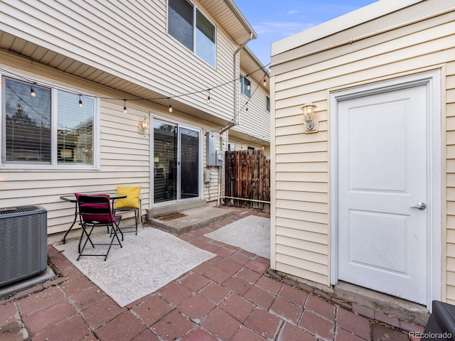 view of patio featuring fence and cooling unit