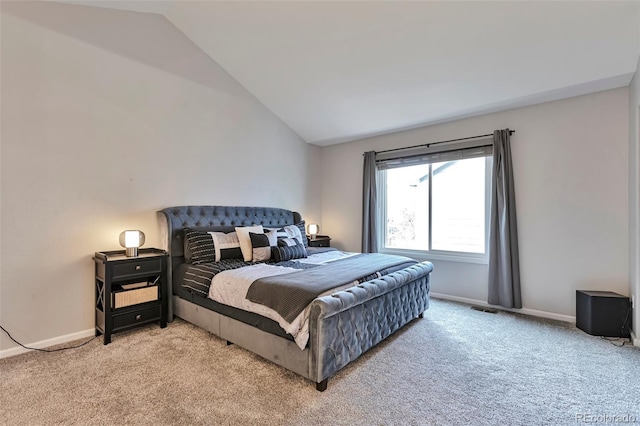 bedroom with light colored carpet, baseboards, lofted ceiling, and visible vents