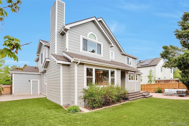 back of property with a patio, outdoor lounge area, and fence