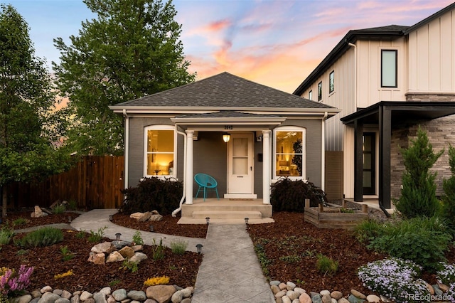 3842 Zenobia St, Denver, CO 80212 - view of front of home featuring board and batten siding, fence, and roof with shingles