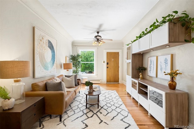 3842 Zenobia St, Denver, CO 80212 - living room with light wood-style floors, ceiling fan, and a baseboard radiator