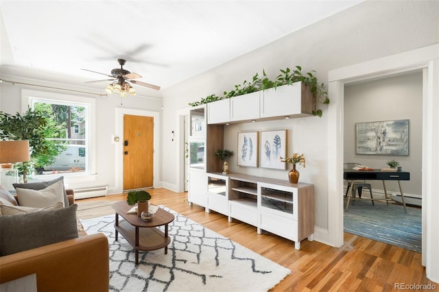 3842 Zenobia St, Denver, CO 80212 - living area with light wood finished floors, ceiling fan, baseboard heating, baseboards, and a baseboard heating unit