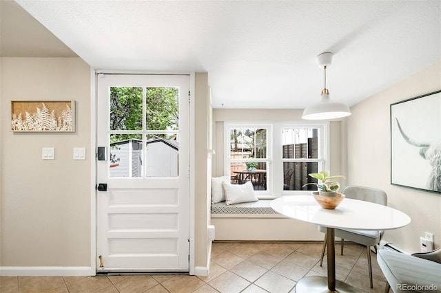 3842 Zenobia St, Denver, CO 80212 - dining space with light tile patterned floors, healthy amount of natural light, and baseboards