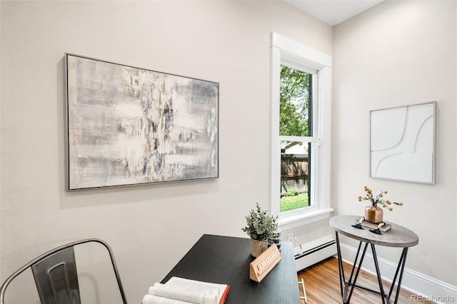 3842 Zenobia St, Denver, CO 80212 - office area featuring a baseboard radiator, wood finished floors, and baseboards