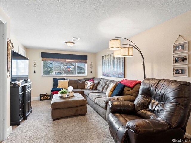 6500 S Downing St, Centennial, CO 80121 - living area with a textured ceiling, visible vents, and light carpet