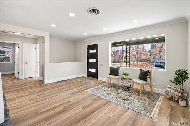 entryway featuring recessed lighting, wood finished floors, visible vents, and baseboards