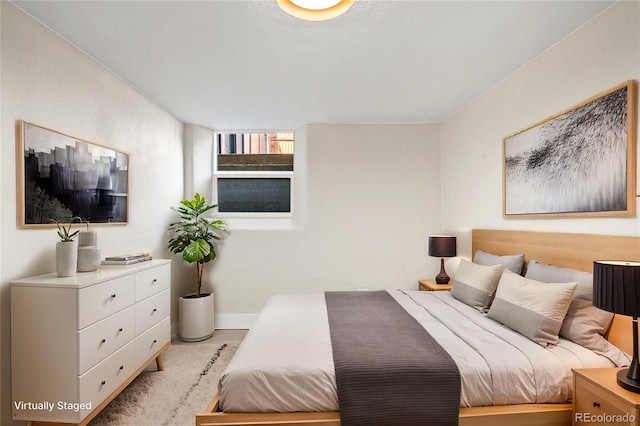 bedroom featuring baseboards