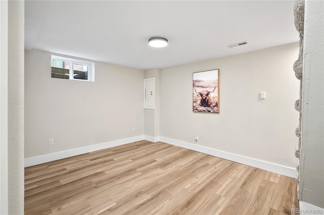 interior space with visible vents, baseboards, and light wood-style floors