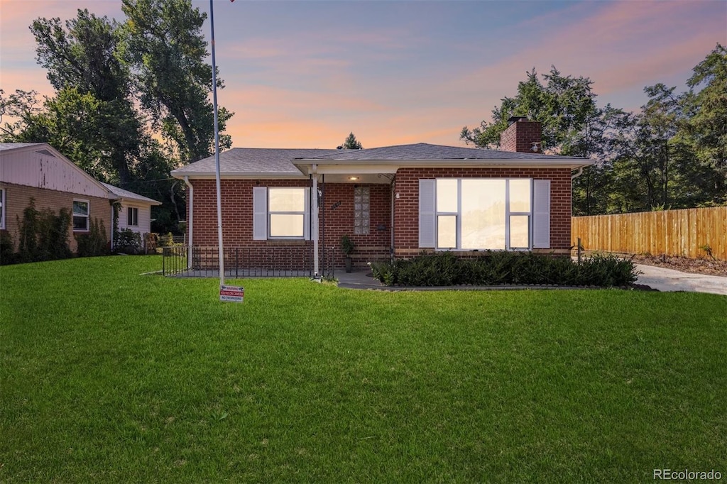 view of front of property with a yard