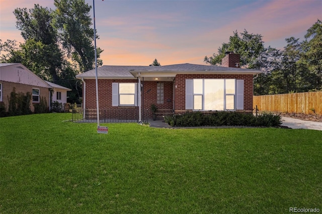 view of front of property with a yard