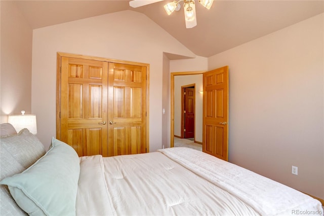 bedroom featuring lofted ceiling, ceiling fan, and a closet