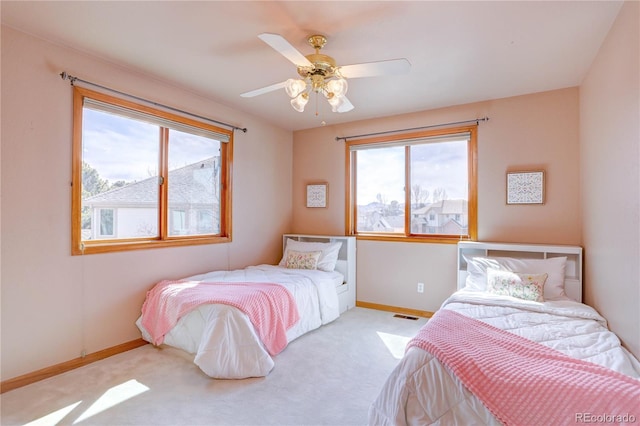 bedroom featuring baseboards, carpet floors, and ceiling fan