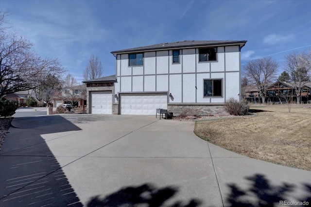 back of house featuring driveway, an attached garage, and stucco siding