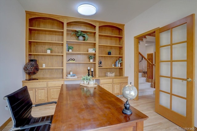 office area with light wood-style floors