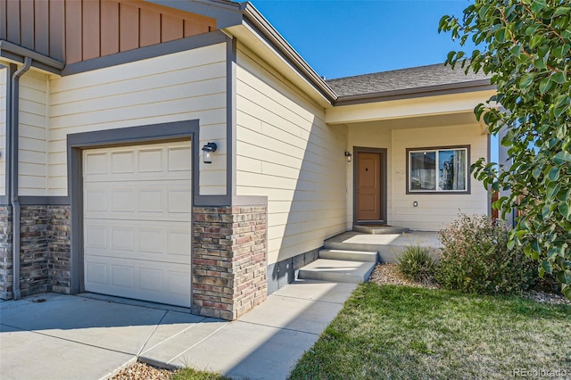 view of exterior entry featuring a garage