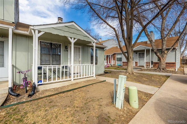 exterior space featuring board and batten siding and covered porch