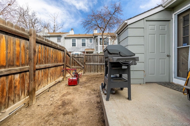 exterior space featuring a patio area and a fenced backyard