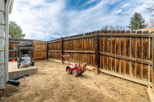 view of yard with a fenced backyard