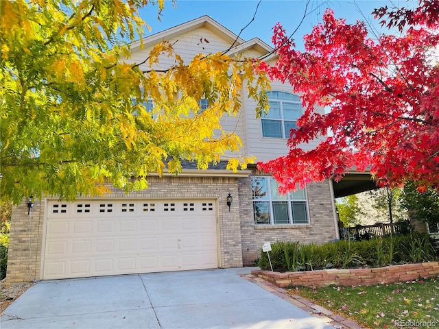 16866 E Peakview Ave, Aurora, CO 80016 - traditional home with brick siding and concrete driveway