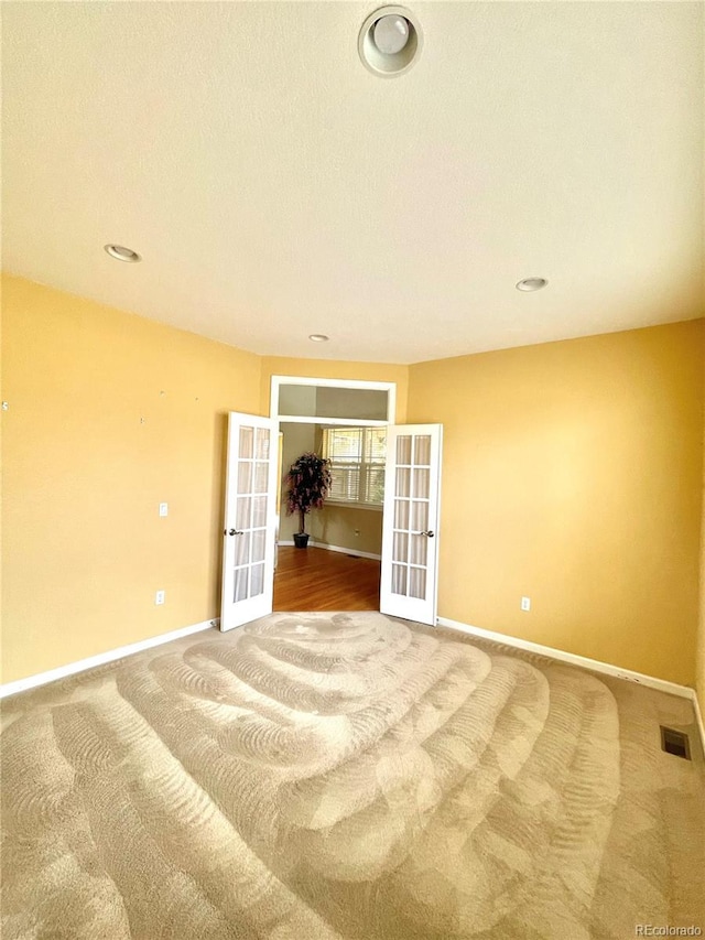 16866 E Peakview Ave, Aurora, CO 80016 - carpeted spare room featuring french doors and recessed lighting