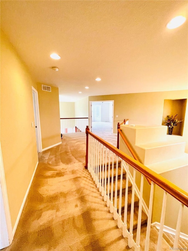 16866 E Peakview Ave, Aurora, CO 80016 - corridor featuring an upstairs landing, carpet, recessed lighting, and a textured ceiling