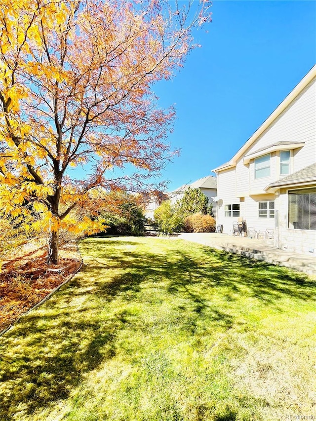 16866 E Peakview Ave, Aurora, CO 80016 - view of green lawn with a patio area