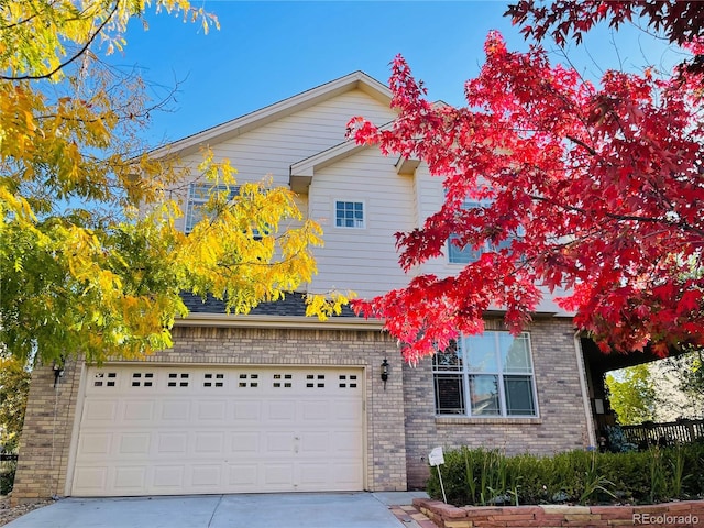 16866 E Peakview Ave, Aurora, CO 80016 - view of front facade with concrete driveway and brick siding