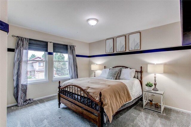 bedroom featuring carpet flooring and baseboards