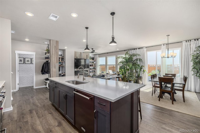 4522 Barrow Ln, Timnath, CO 80547 - kitchen featuring dishwasher, a sink, light countertops, baseboards, and dark wood-type flooring
