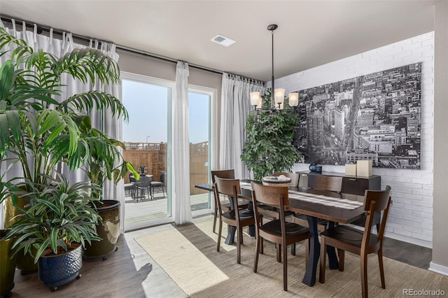 4522 Barrow Ln, Timnath, CO 80547 - dining area with wood finished floors and a chandelier
