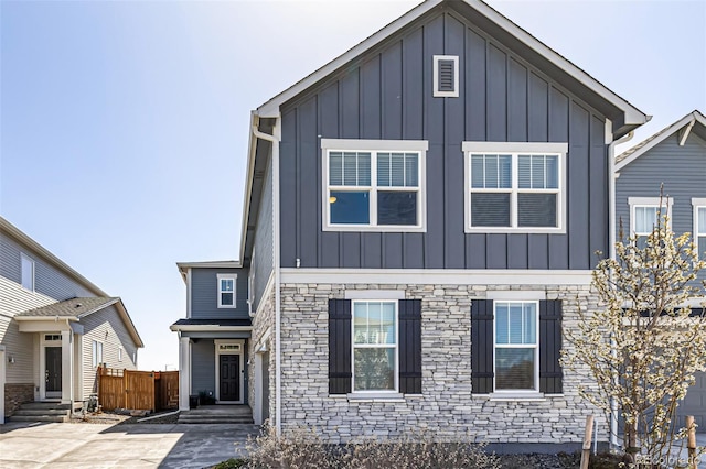 4522 Barrow Ln, Timnath, CO 80547 - view of front facade with board and batten siding, entry steps, and stone siding