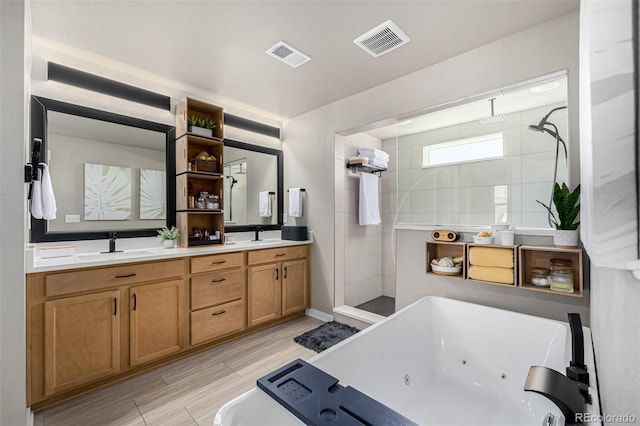 4522 Barrow Ln, Timnath, CO 80547 - full bathroom with a whirlpool tub, walk in shower, double vanity, and wood finish floors