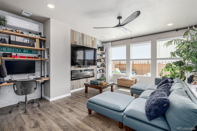4522 Barrow Ln, Timnath, CO 80547 - living area with ceiling fan, wood finished floors, recessed lighting, a textured ceiling, and baseboards