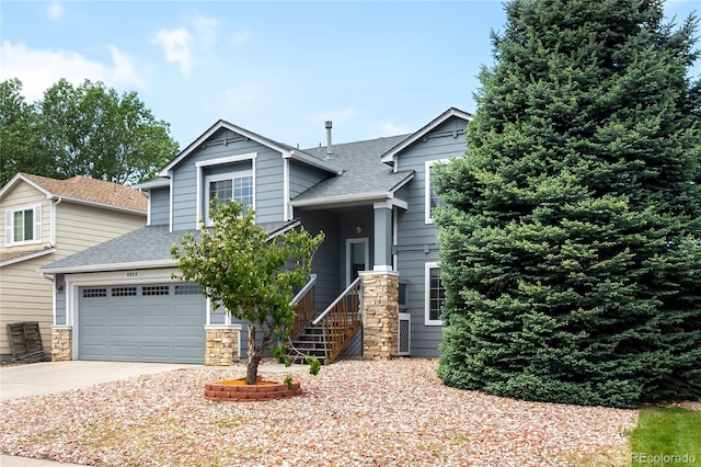 8879 Apache Plume Dr, Parker, CO 80134 - view of front facade with roof with shingles, driveway, stone siding, and an attached garage