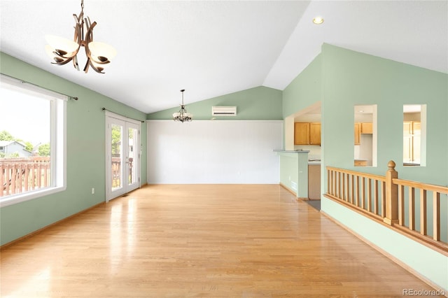 8879 Apache Plume Dr, Parker, CO 80134 - empty room with a chandelier, vaulted ceiling, light wood finished floors, and recessed lighting