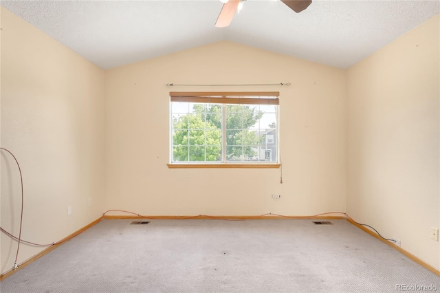 8879 Apache Plume Dr, Parker, CO 80134 - spare room with carpet floors, vaulted ceiling, baseboards, and a ceiling fan