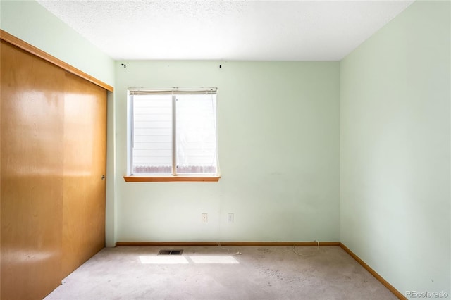 8879 Apache Plume Dr, Parker, CO 80134 - unfurnished bedroom featuring a closet, baseboards, and carpet