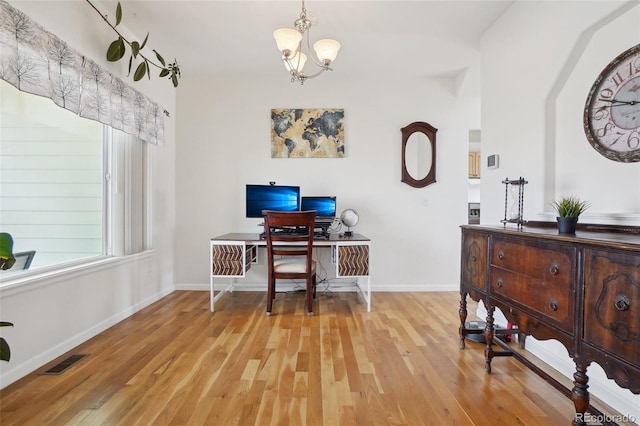 16665 Kenuil St, Brighton, CO 80603 - office area with light wood-type flooring, a chandelier, and baseboards