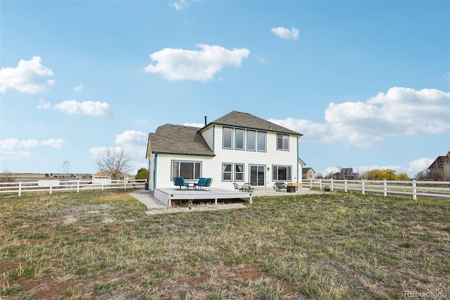 16665 Kenuil St, Brighton, CO 80603 - back of property with a wooden deck and a shingled roof