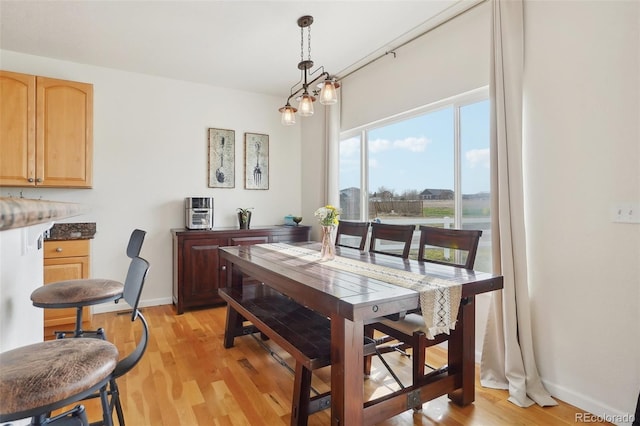 16665 Kenuil St, Brighton, CO 80603 - dining area featuring light wood-type flooring and baseboards