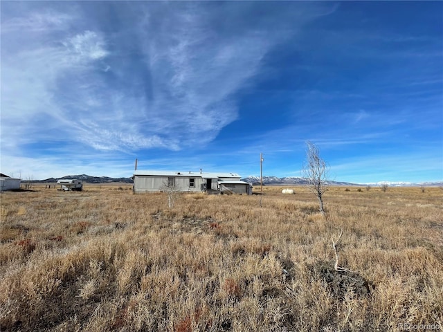 view of yard with a rural view