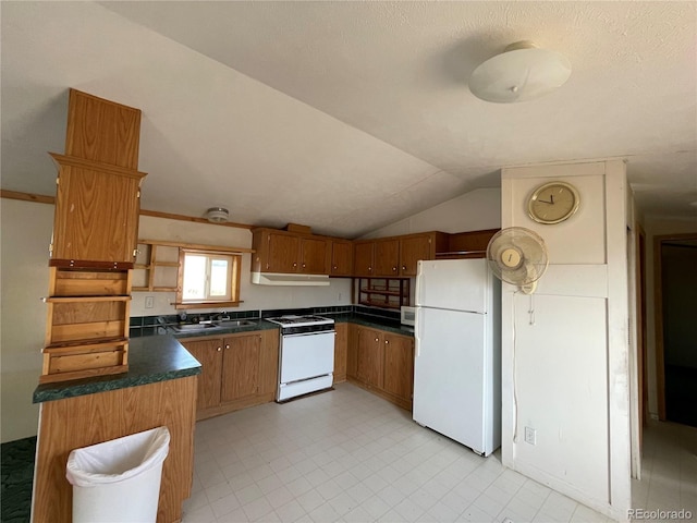 kitchen featuring a textured ceiling, white appliances, lofted ceiling, and sink