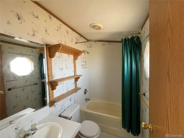 full bathroom with shower / bath combo with shower curtain, vanity, and toilet