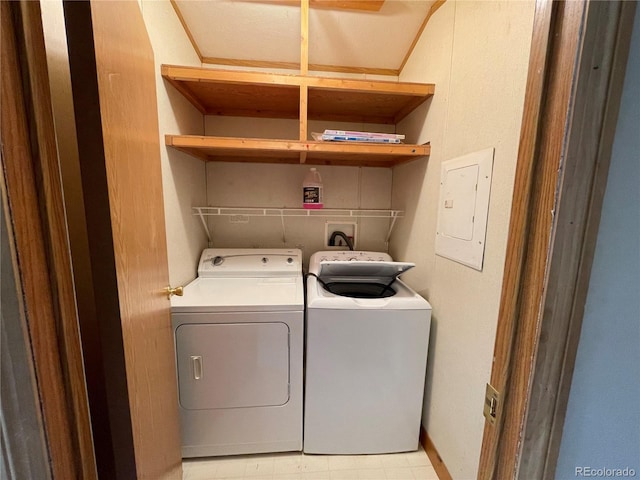 laundry room featuring washer and clothes dryer and electric panel