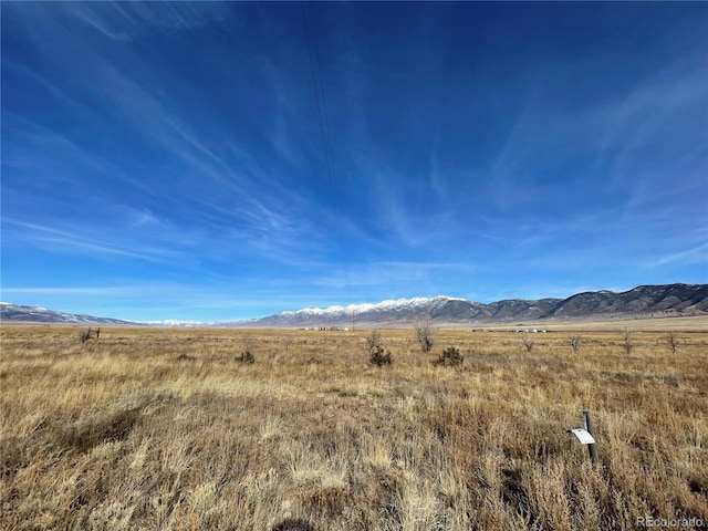 mountain view featuring a rural view