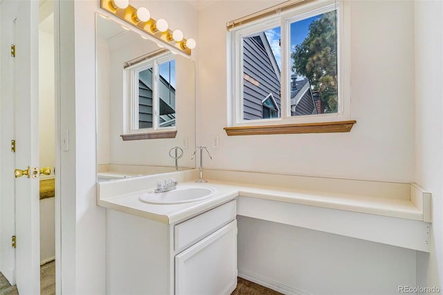 72 S Nome St, Aurora, CO 80012 - bathroom with plenty of natural light and vanity